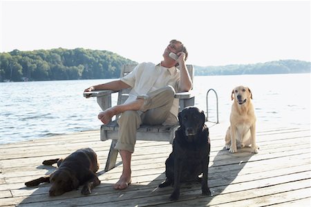 simsearch:600-01124353,k - Man on Dock with Dogs, Three Mile Lake, Muskoka, Ontario, Canada Stock Photo - Premium Royalty-Free, Code: 600-01111425