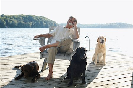simsearch:600-01124353,k - Man on Dock with Dogs, Three Mile Lake, Muskoka, Ontario, Canada Stock Photo - Premium Royalty-Free, Code: 600-01111426