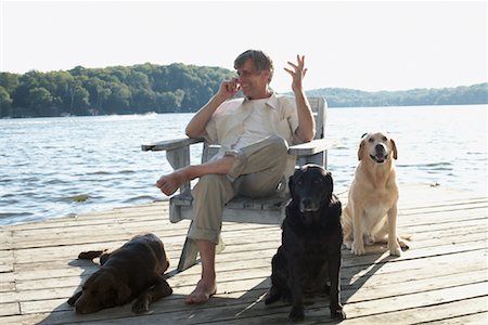 simsearch:600-01124353,k - Man on Dock with Dogs, Three Mile Lake, Muskoka, Ontario, Canada Stock Photo - Premium Royalty-Free, Code: 600-01111427