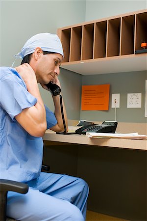 Doctor Talking on Telephone Stock Photo - Premium Royalty-Free, Code: 600-01111605