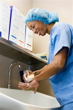 Doctor Scrubbing Hands Stock Photo - Premium Royalty-Free, Code: 600-01111602