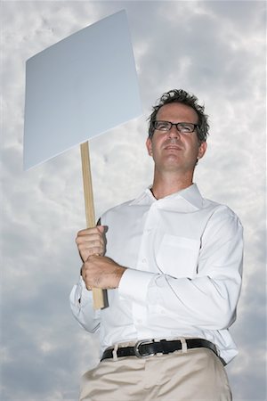 protester holding sign - Man Holding Sign Stock Photo - Premium Royalty-Free, Code: 600-01112005