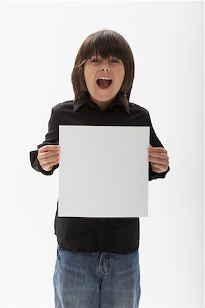 simsearch:700-00047115,k - Portrait of Boy Holding Blank Paper Stock Photo - Premium Royalty-Free, Code: 600-01112018