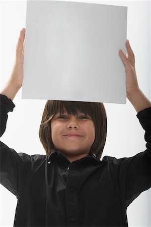 simsearch:700-00047115,k - Portrait of Boy Holding Blank Paper Stock Photo - Premium Royalty-Free, Code: 600-01112019