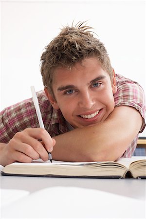 simsearch:600-02973192,k - Male Student with Textbook Stock Photo - Premium Royalty-Free, Code: 600-01112306