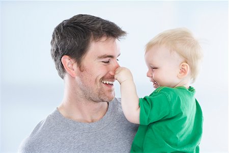 simsearch:600-02348915,k - Son Pulling Father's Nose Stock Photo - Premium Royalty-Free, Code: 600-01112888