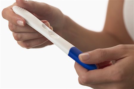simsearch:700-02056623,k - Woman Holding Pregnancy Test Stock Photo - Premium Royalty-Free, Code: 600-01112899
