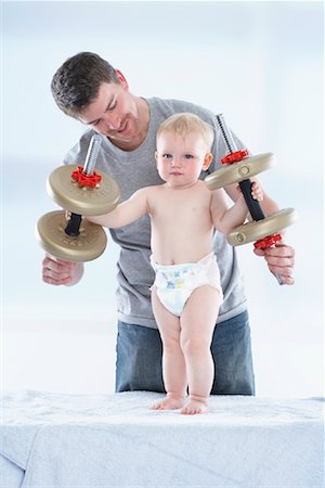 simsearch:700-06758135,k - Father and Son Playing with Weights Stock Photo - Premium Royalty-Free, Code: 600-01112891