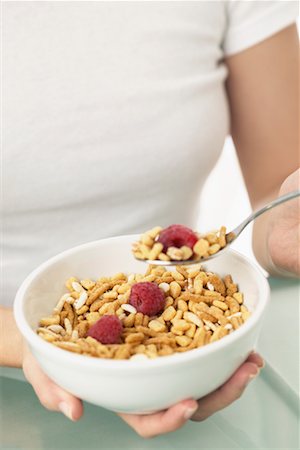 Woman Holding Bowl of Cereal Stock Photo - Premium Royalty-Free, Code: 600-01112905