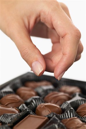 simsearch:600-02033679,k - Hand Reaching for Chocolate Stock Photo - Premium Royalty-Free, Code: 600-01112902