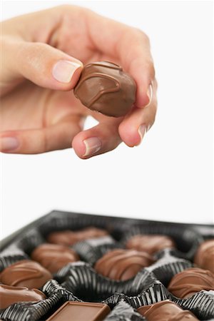 simsearch:600-02033679,k - Hand Holding Chocolate Stock Photo - Premium Royalty-Free, Code: 600-01112903