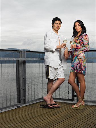 relax cottage lake - Couple Standing on Deck by Ocean Drinking Wine Stock Photo - Premium Royalty-Free, Code: 600-01124841