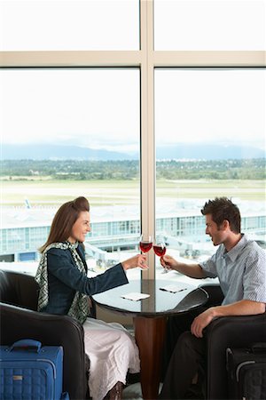 simsearch:700-00529622,k - Couple Toasting in Airport, Vancouver, British Columbia, Canada Stock Photo - Premium Royalty-Free, Code: 600-01124850
