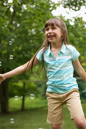 simsearch:600-03692097,k - Girl Playing With Bubbles Stock Photo - Premium Royalty-Free, Code: 600-01120309