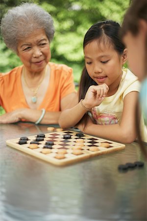 simsearch:700-00046927,k - People Playing Checkers Stock Photo - Premium Royalty-Free, Code: 600-01120320