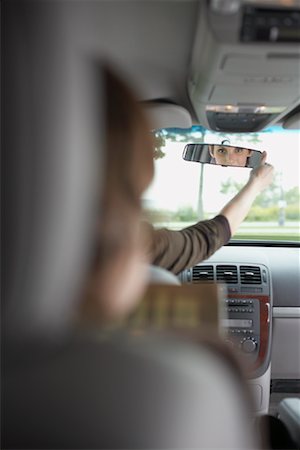 simsearch:700-01172393,k - Mother Looking Back at her Son in Rear-View Mirror Stock Photo - Premium Royalty-Free, Code: 600-01123706