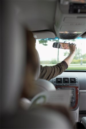simsearch:700-01172393,k - Mother Looking Back at her Son in Rear-View Mirror Stock Photo - Premium Royalty-Free, Code: 600-01123707