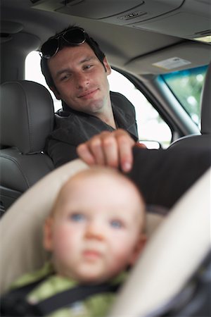 simsearch:614-06623416,k - Father Looking Back at Baby in Vehicle Stock Photo - Premium Royalty-Free, Code: 600-01123718
