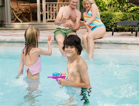 sisters feet - Family Pool Side Stock Photo - Premium Royalty-Free, Code: 600-01164461