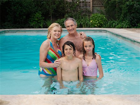 simsearch:700-01234773,k - Family in Swimming Pool Stock Photo - Premium Royalty-Free, Code: 600-01164473