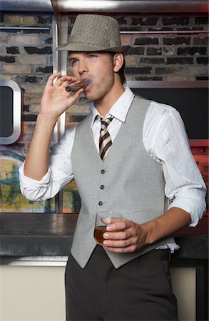disco style man - Portrait of Man Smoking Cigar Stock Photo - Premium Royalty-Free, Code: 600-01163422