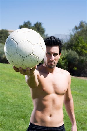 foreshortening people - Portrait of Man with Soccer Ball Stock Photo - Premium Royalty-Free, Code: 600-01163651