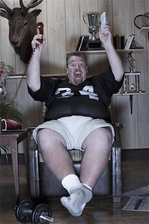 fat man full body - Portrait of Man Watching Television Stock Photo - Premium Royalty-Free, Code: 600-01163900