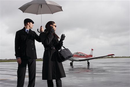 Man and Woman on Airport Tarmac Stock Photo - Premium Royalty-Free, Code: 600-01174014
