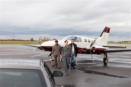 servicing a plane - Businesswoman at Airport Stock Photo - Premium Royalty-Free, Code: 600-01174056