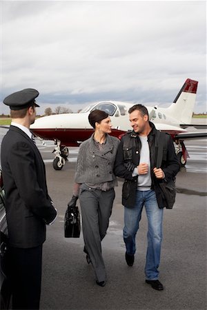 prop plane - Chauffeur Waiting for Passengers at Airport Stock Photo - Premium Royalty-Free, Code: 600-01174052
