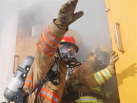 Firefighters Entering Building Stock Photo - Premium Royalty-Free, Code: 600-01172188