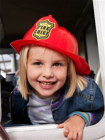 fire truck - Portrait of Girl in Fire Truck Stock Photo - Premium Royalty-Free, Code: 600-01172286