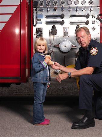 Man and Girl by Fire Truck Stock Photo - Premium Royalty-Free, Code: 600-01172297