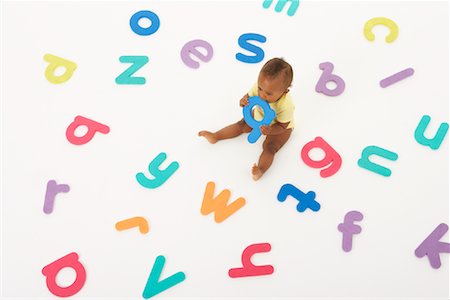 simsearch:600-01172746,k - Baby Surrounded by Letters Stock Photo - Premium Royalty-Free, Code: 600-01172718