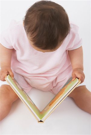 simsearch:600-01172751,k - Baby Looking at Book Stock Photo - Premium Royalty-Free, Code: 600-01172723