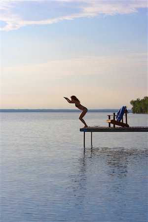 relax cottage lake - Woman Diving off of Dock Stock Photo - Premium Royalty-Free, Code: 600-01172999