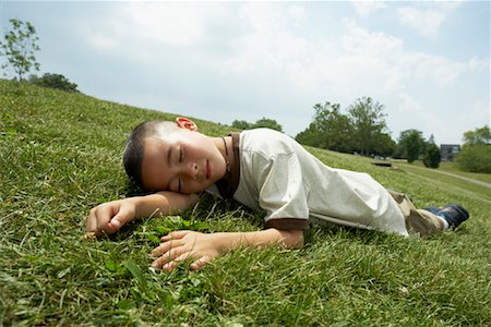 simsearch:614-07031844,k - Boy Lying Down on Grass Stock Photo - Premium Royalty-Free, Code: 600-01173610
