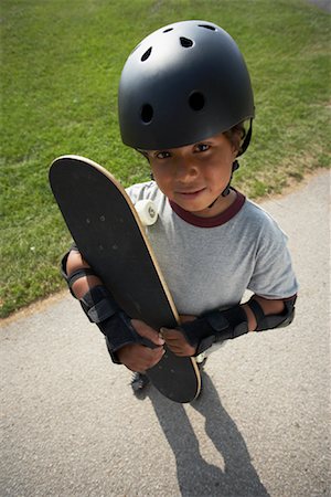 Boy Holding Skateboard Stock Photo - Premium Royalty-Free, Code: 600-01173630