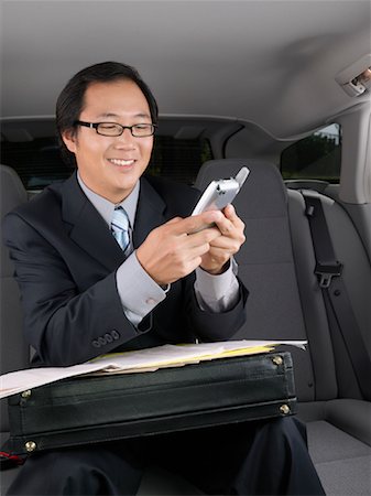 simsearch:700-03058969,k - Businessman Working in Car Stock Photo - Premium Royalty-Free, Code: 600-01173837