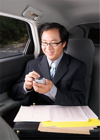 simsearch:700-03058969,k - Businessman Working in Car Stock Photo - Premium Royalty-Free, Code: 600-01173838