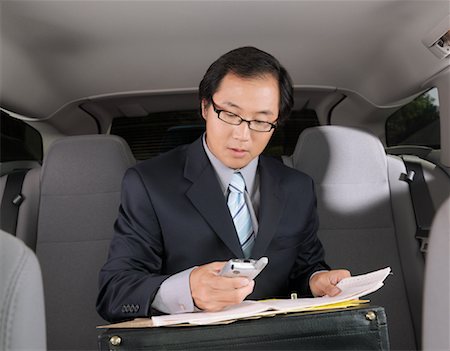 simsearch:700-03058969,k - Businessman Working in Car Stock Photo - Premium Royalty-Free, Code: 600-01173833