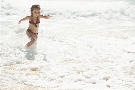 Little Girl Running on the Beach Stock Photo - Premium Royalty-Free, Code: 600-01184415