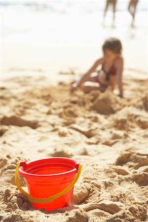 simsearch:600-00176667,k - Bucket on Beach, Little Girl Playing in the Sand Stock Photo - Premium Royalty-Free, Code: 600-01184416