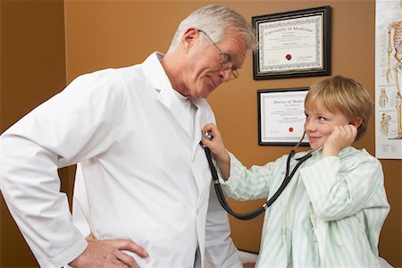 pediatricians office - Boy Playing with Doctor's Stethoscope Stock Photo - Premium Royalty-Free, Code: 600-01194788