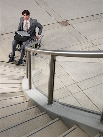 simsearch:600-02756616,k - Man in Wheelchair Looking at Staircase Foto de stock - Sin royalties Premium, Código: 600-01194821