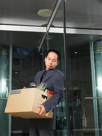 Man Carrying Box of Belongings Stock Photo - Premium Royalty-Free, Code: 600-01194847