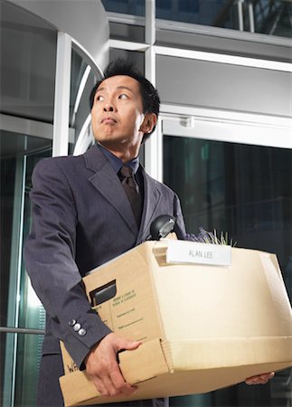 revolve - Man Carrying Box of Belongings Stock Photo - Premium Royalty-Free, Code: 600-01194848