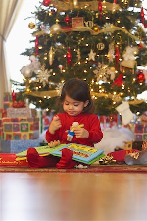 Little Girl on Christmas Morning Stock Photo - Premium Royalty-Free, Code: 600-01195004