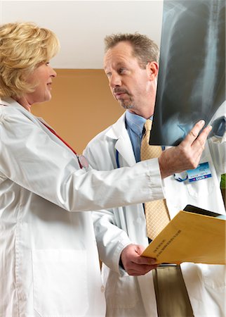 simsearch:700-03501276,k - Doctors Looking at X-Ray Stock Photo - Premium Royalty-Free, Code: 600-01195060