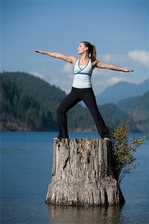 simsearch:700-00453545,k - Woman Doing Yoga on Tree Stump Stock Photo - Premium Royalty-Free, Code: 600-01195474